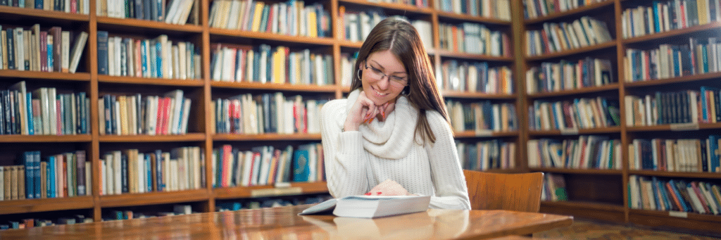 Student in library reading